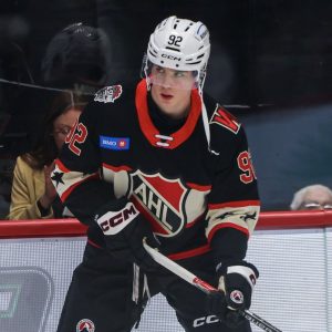 Brett Sutter on Matevi Gridin and Hunter Brzustewicz.